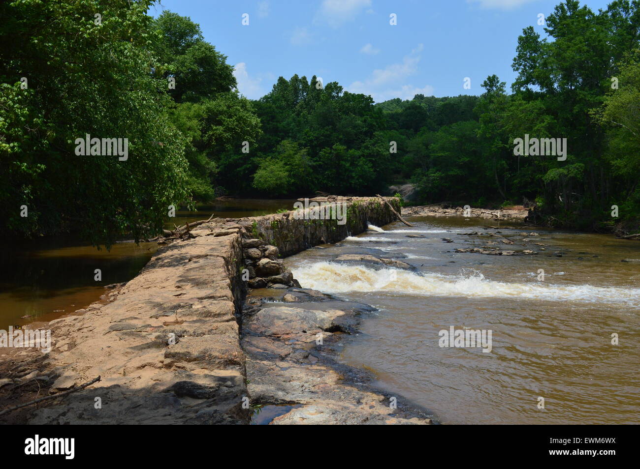Dam blocking the flow of water Stock Photo