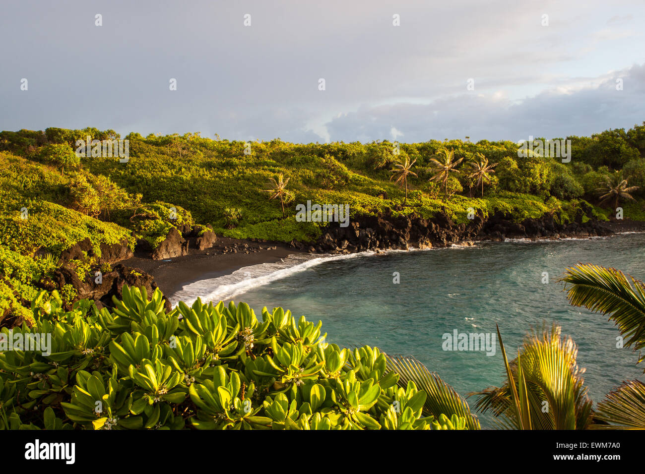 A view of the black sand beach at Wai'anapanapa State Park in Maui, Hawaii. Stock Photo