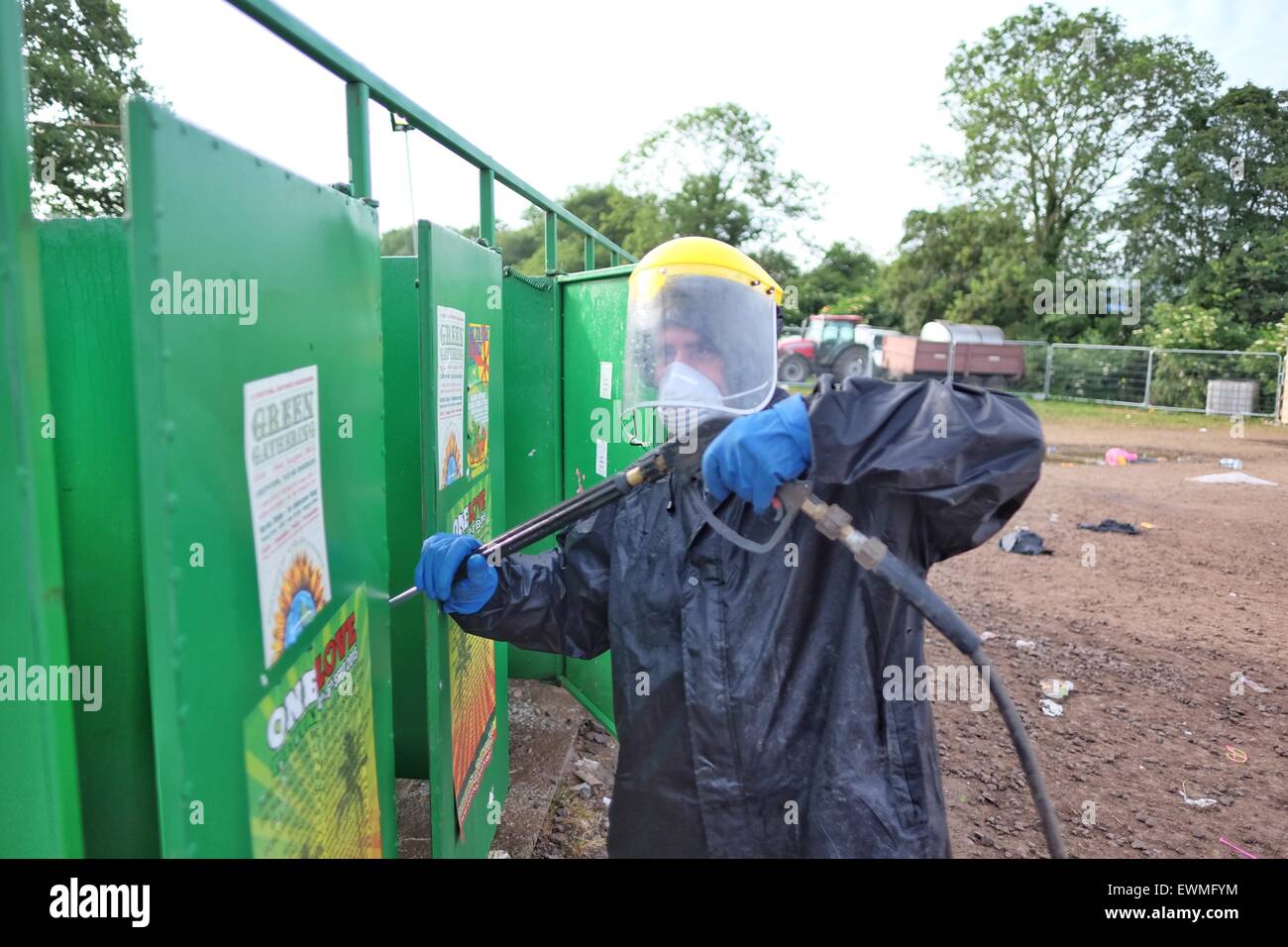 Glastonbury Festival, Somerset, UK. 29 June 2015. As the exodus from the festival site gets underway the clean up begins in earnest and the notorious long drop toilets get the pressure washer treatment. Credit:  Tom Corban/Alamy Live News Stock Photo