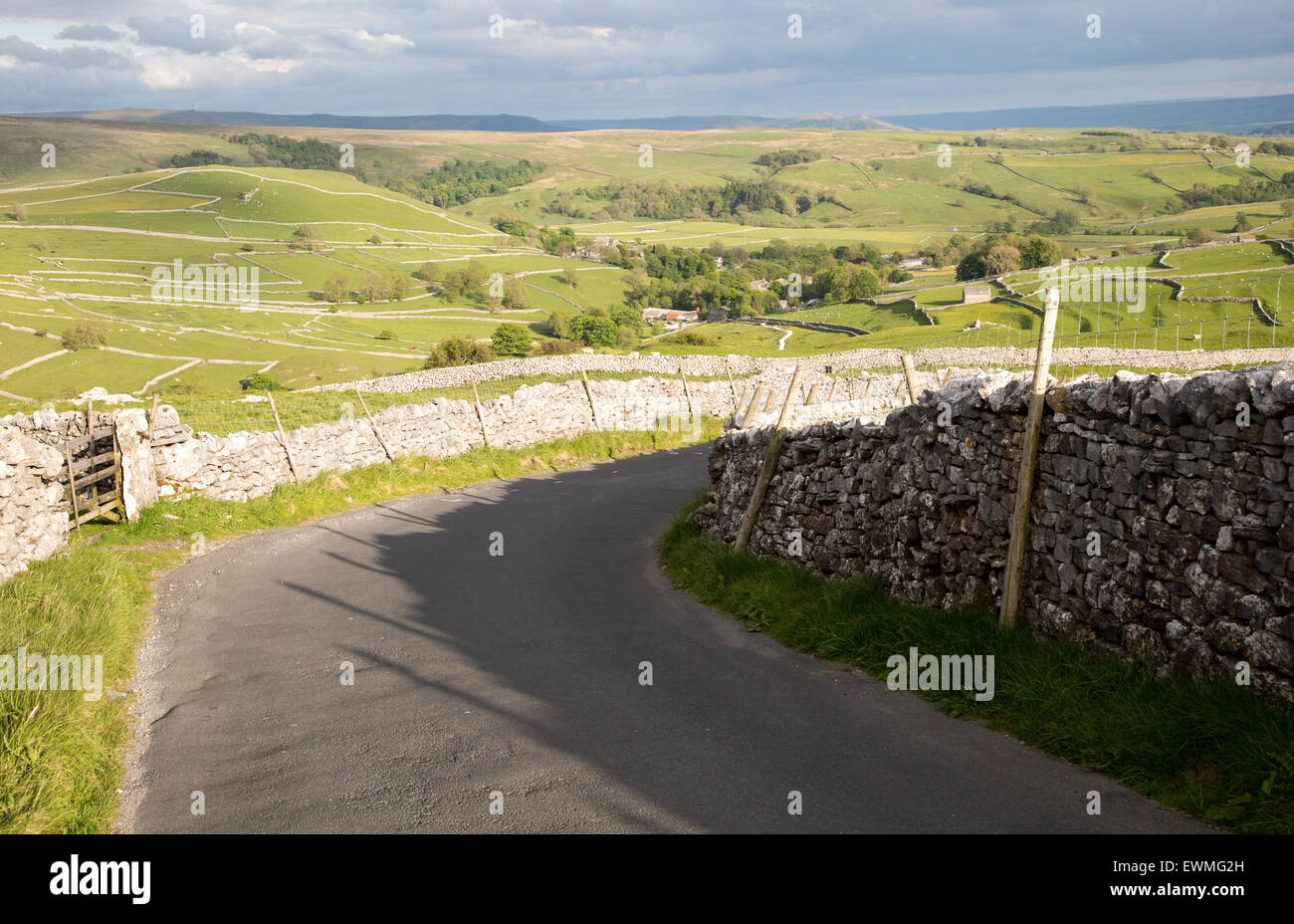 Country lane and dry stonewalls, Malham, Yorkshire Dales national park, England, UK Stock Photo
