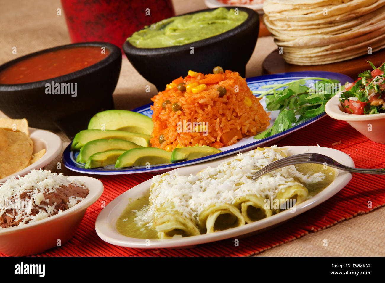 Stock image of traditional mexican green enchilada dinner Stock Photo