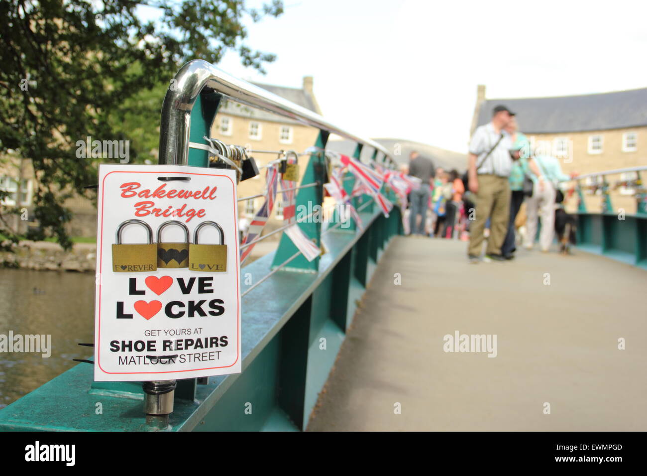 Love locks are advertised for sale on a bridge featuring these romantic