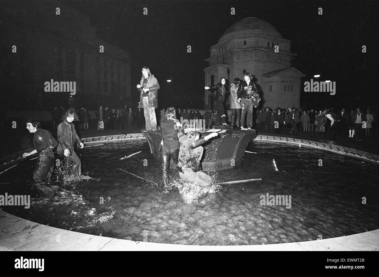 New Year Revellers seeing in 1973 by taking a quick dip in the fountain in Centenary Square Birmingham. 31st December 1972 Stock Photo