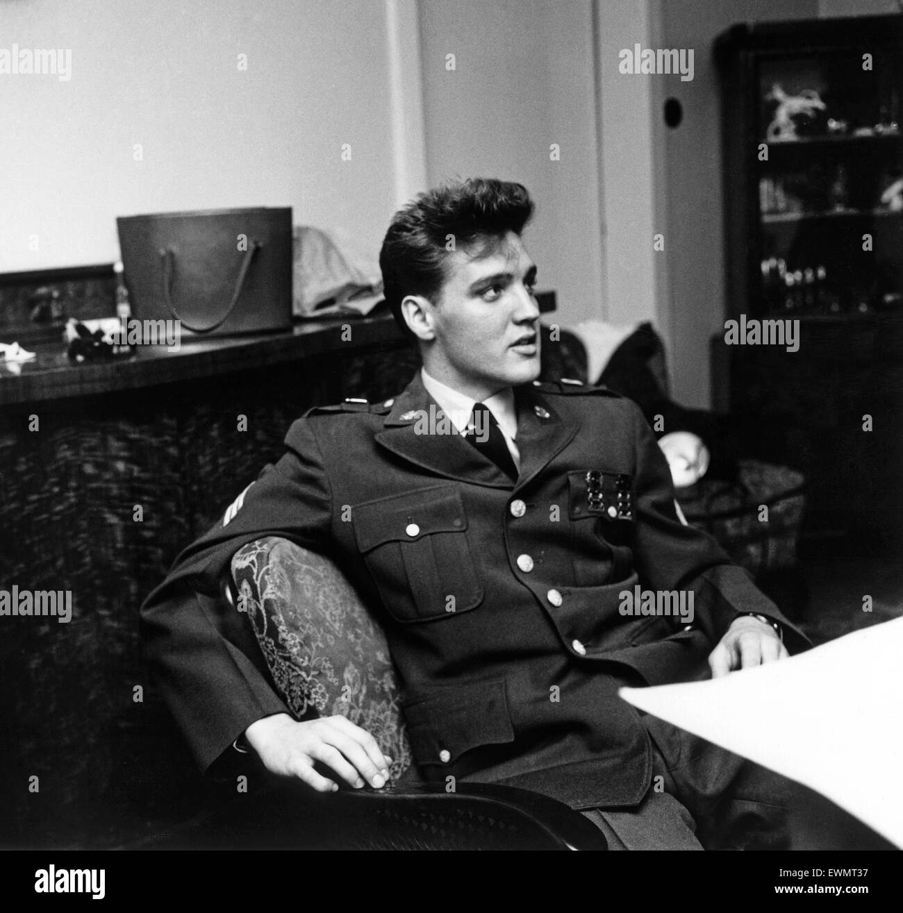 American rock and roll singer and musician Elvis Presley pictured wearing army uniform before attending a press conference in Germany. March 1960. Stock Photo