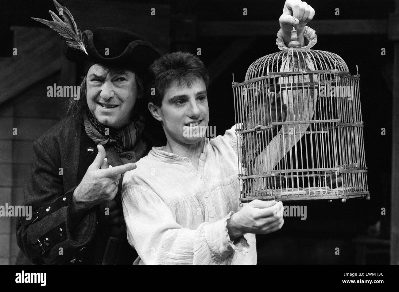 Treasure Island, Pantomime, Photo-call, Birmingham Repertory Theatre, Birmingham, 20th December 1984. Jack Douglas, comedian, plays Long John Silver, pictured with live parrot in the role of Captain Flint. Stock Photo