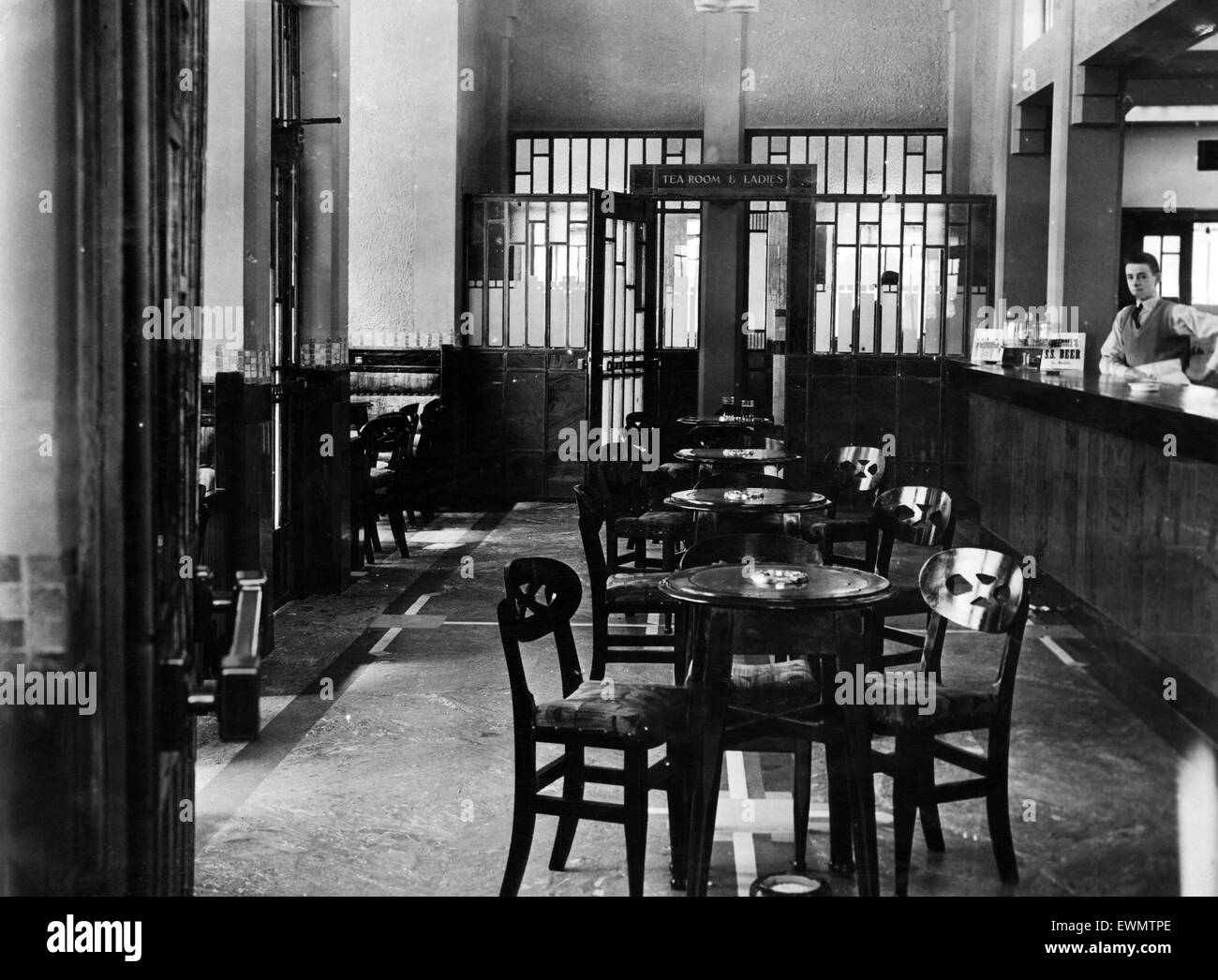 The lounge the Heath Hotel pub in Allerton, Liverpool, complete with spittoons. 1931. Stock Photo