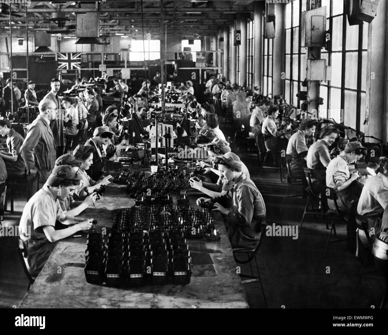 Making meters at Prescot. British Insulated Callender's Cables factory, women making electric light meters. 18th January 1946. Stock Photo