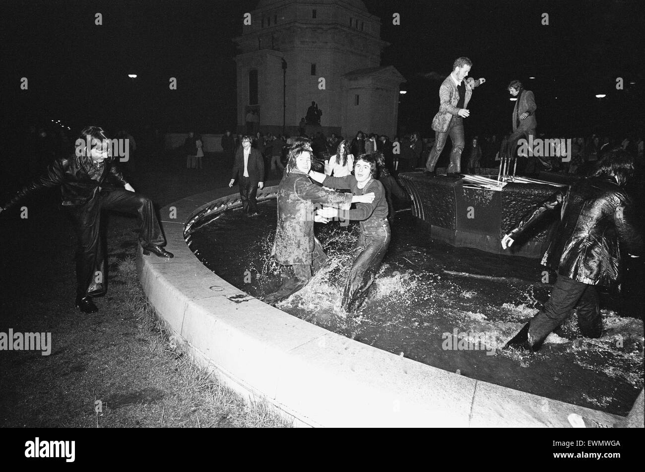 New Year Revellers seeing in 1973 by taking a quick dip in the fountain in Centenary Square Birmingham. 31st December 1972 Stock Photo