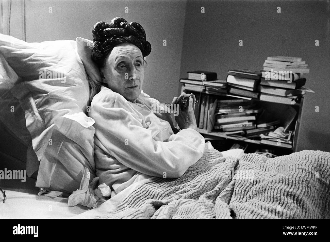 Seventy five year old poet and author Dame Edith Sitwell, in her bed. Dame Edith said about the Daily Mirror: ' I have a great feeling of gratitude... it published my first poem - in 1913 - when no other paper or publisher would have anything to do with m Stock Photo