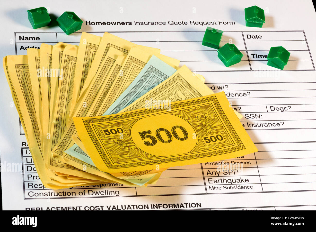 Homeowners insurance quote form with houses and money Stock Photo