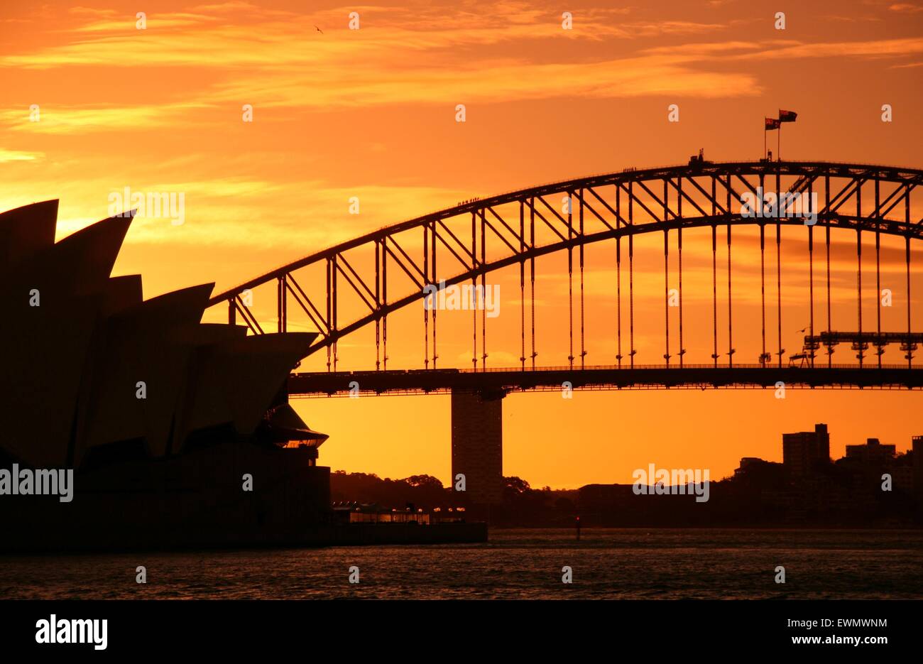 Sydney Opera House and Harbour Bridge at Sunset Stock Photo