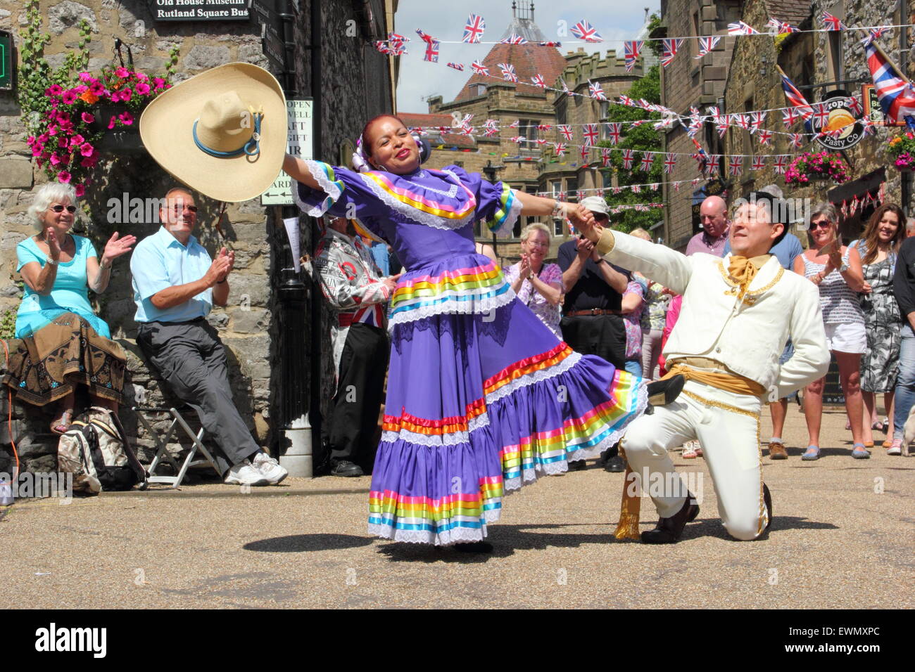 Members of Son de America, a Latin American dance group perform outdoors at the Bakewell International Day of Dance, Bakewell UK Stock Photo