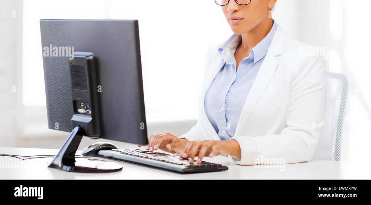 african businesswoman with computer in office Stock Photo - Alamy