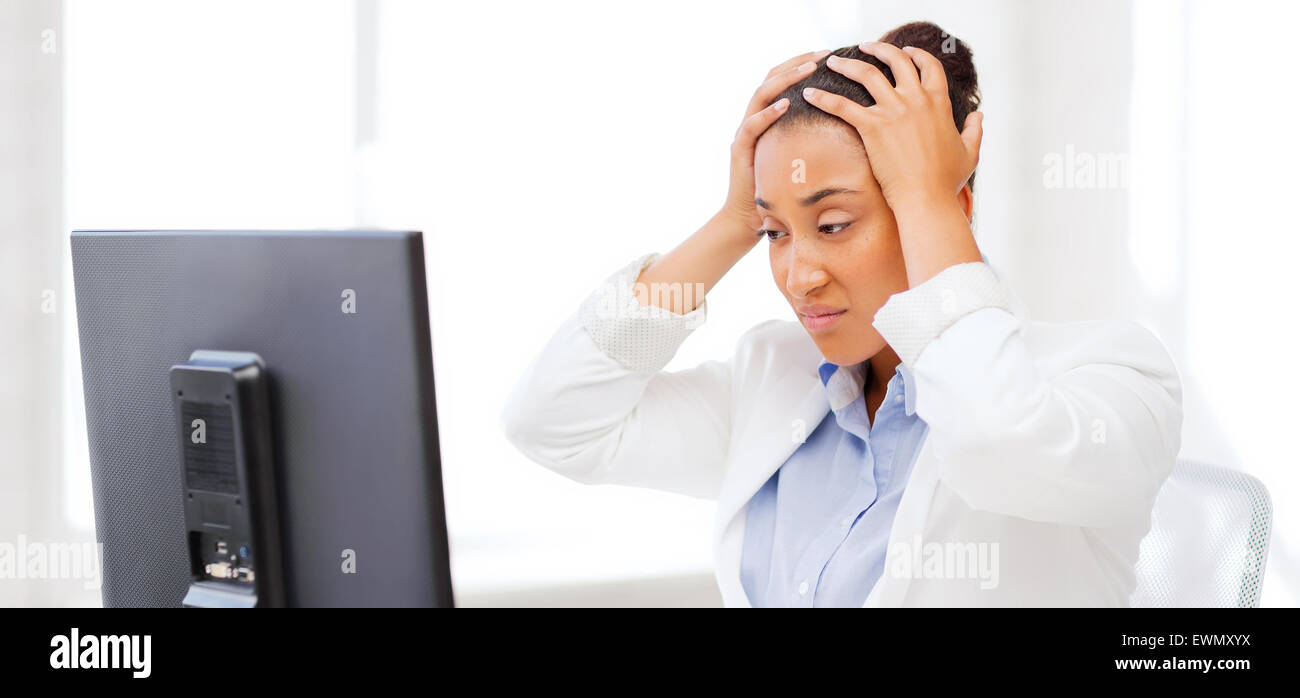 stressed african woman with computer Stock Photo - Alamy
