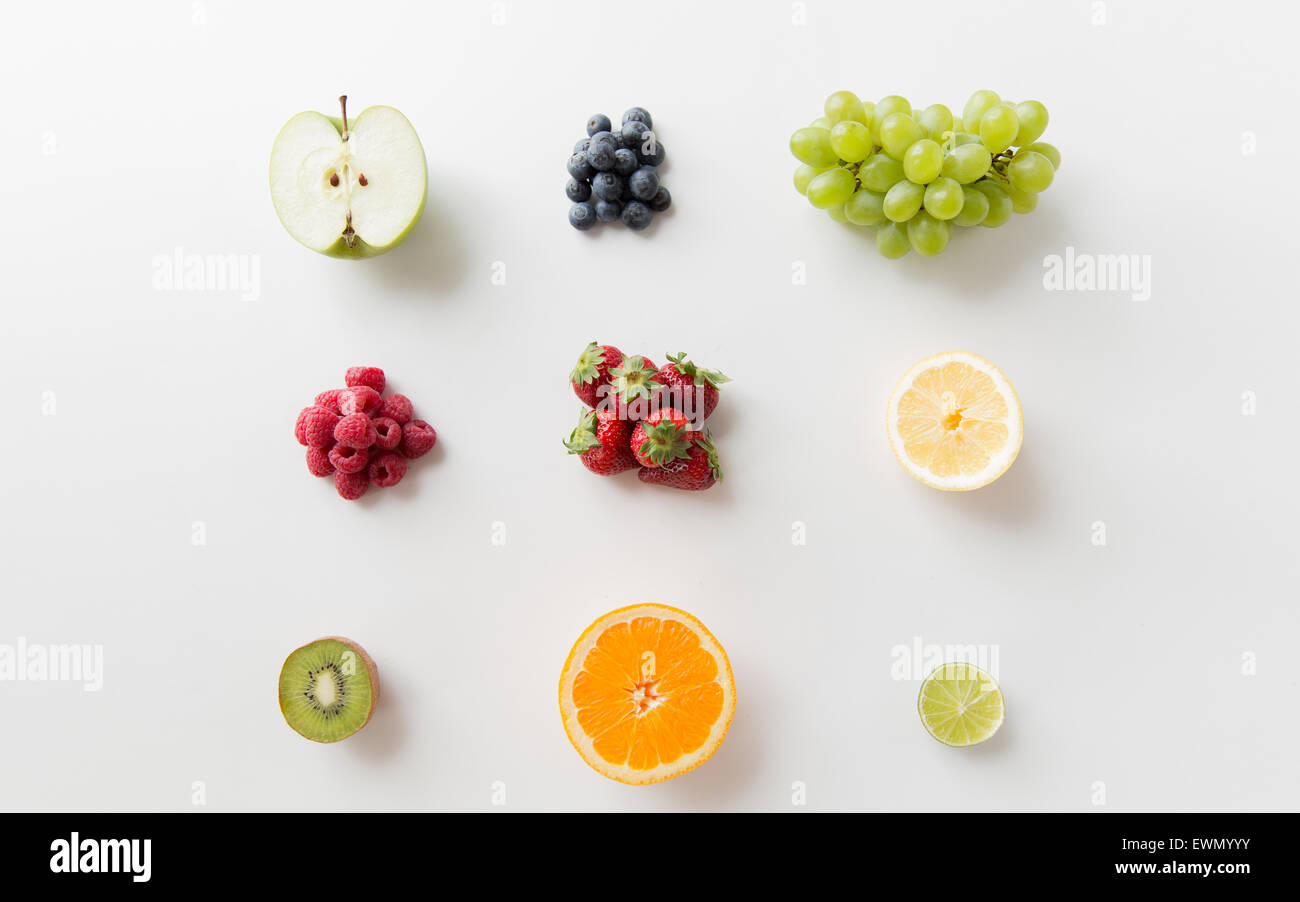 ripe fruits and berries on white surface Stock Photo - Alamy