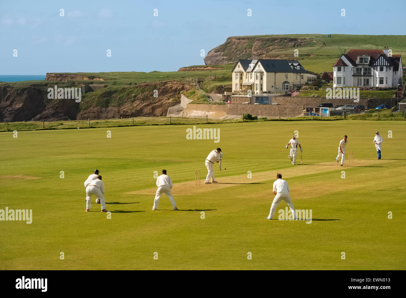 Action at Bude North Cornwall Cricket Club beside the Atlantic Ocean, England, UK Stock Photo