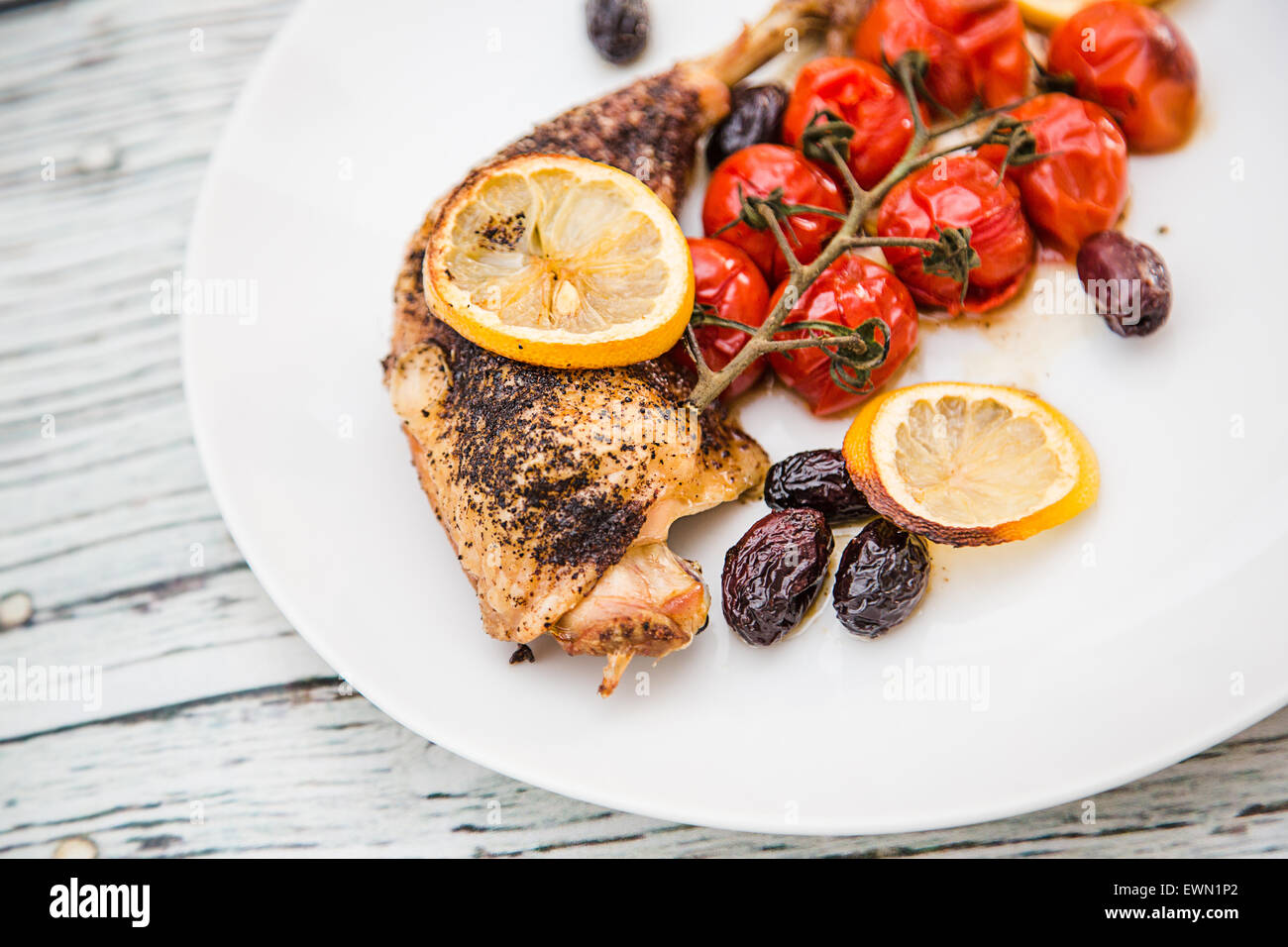 Oven Baked Sumac Chicken with Cherry Tomatoes and Kalamata Olives, Stock Photo