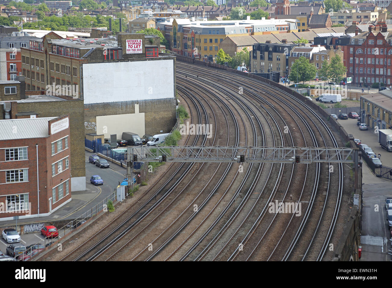 Empty rail tracks close to London's Vauxhall station surrounded by the buildings of south west London Stock Photo