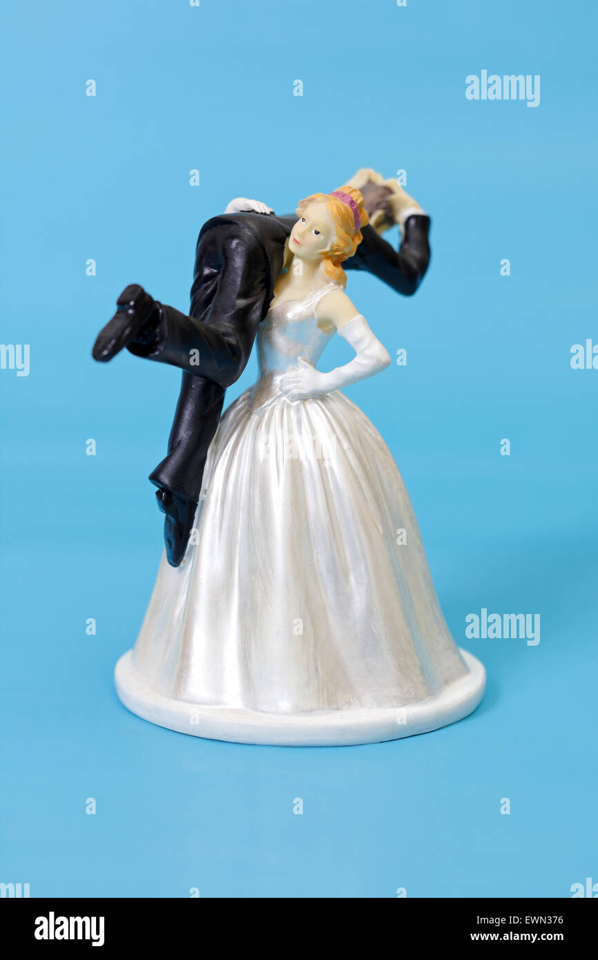 Bride and groom cake topper on blue background Stock Photo - Alamy