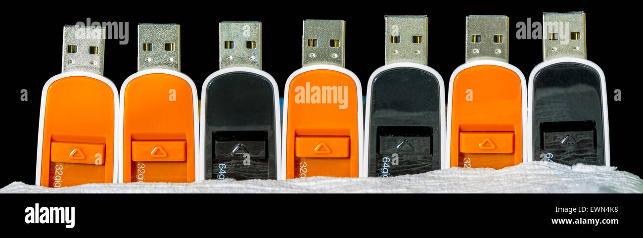Many thumb drives in a row Stock Photo