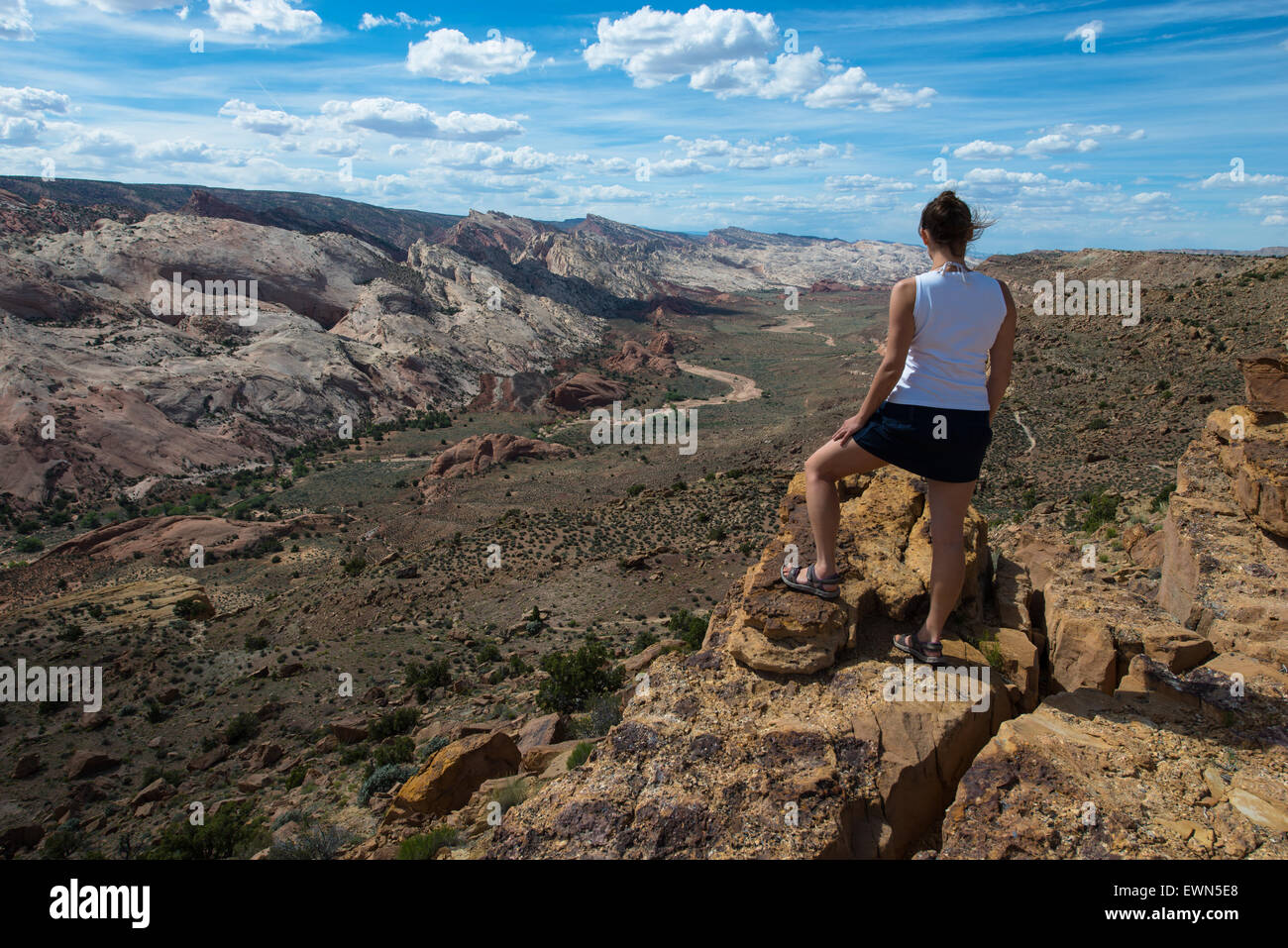 Young Woman looking down the Halls Creek Overlook Capital Reef National