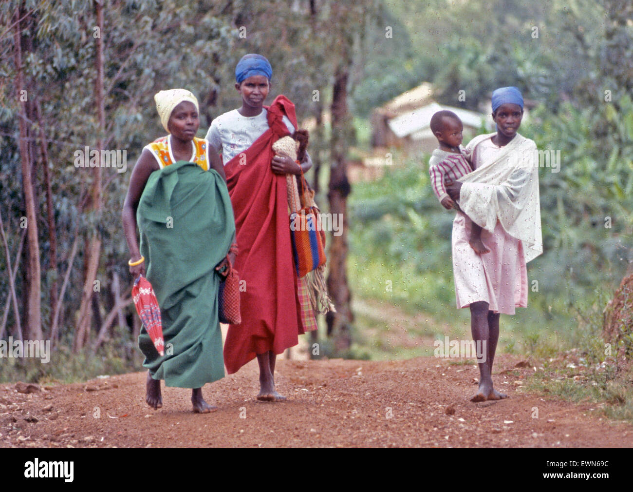 RWANDA AFRICA  THREE WOMEN WALK TO MARKET IN KIGALI Stock Photo