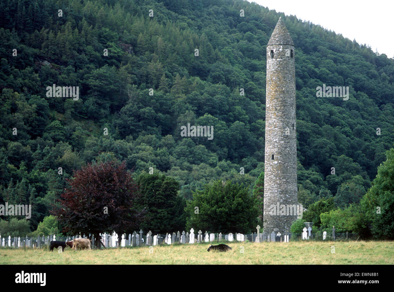 A MONASTIC ROUND TOWER AT GLENDALOUGH CO WICKLOW IRELAND Stock Photo