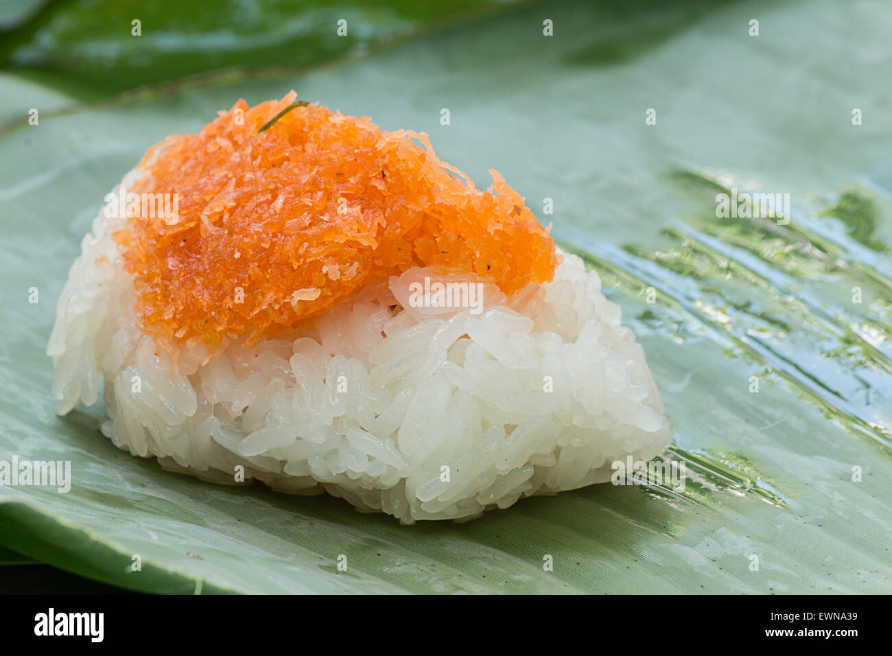 Sticky rice with Shrimp and shred coconut , wrapped in banana Stock Photo