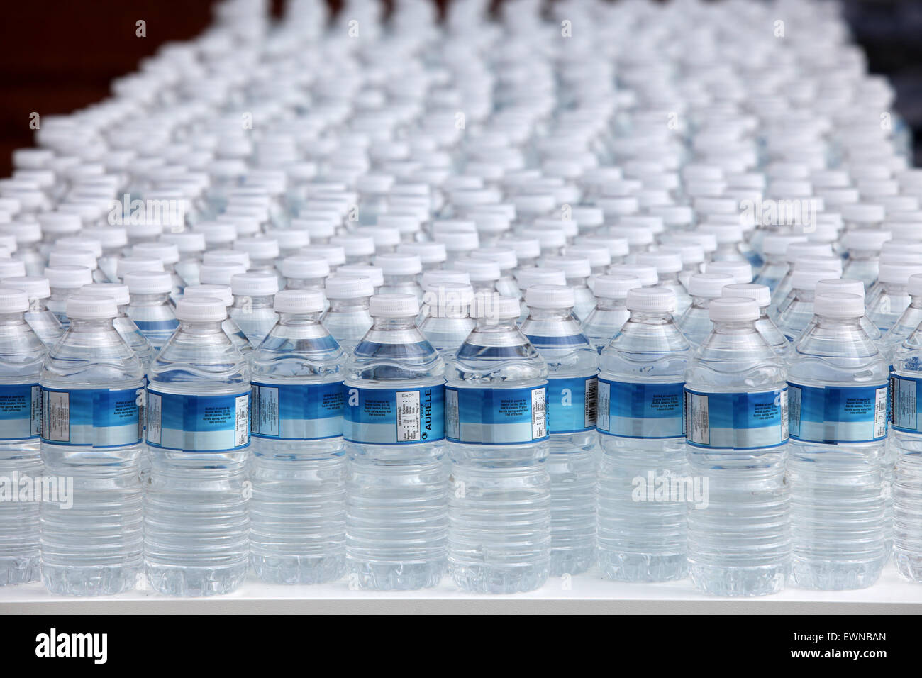 https://c8.alamy.com/comp/EWNBAN/rows-of-plastic-bottles-of-drinking-water-EWNBAN.jpg