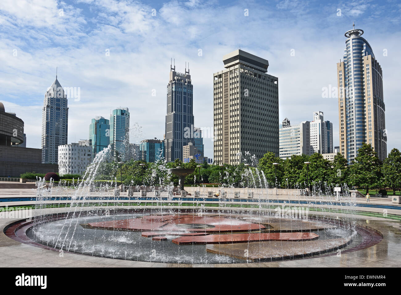 Fountain with people and children on People's Square Municipal Government Building Shanghai Municipality China skyline city Stock Photo