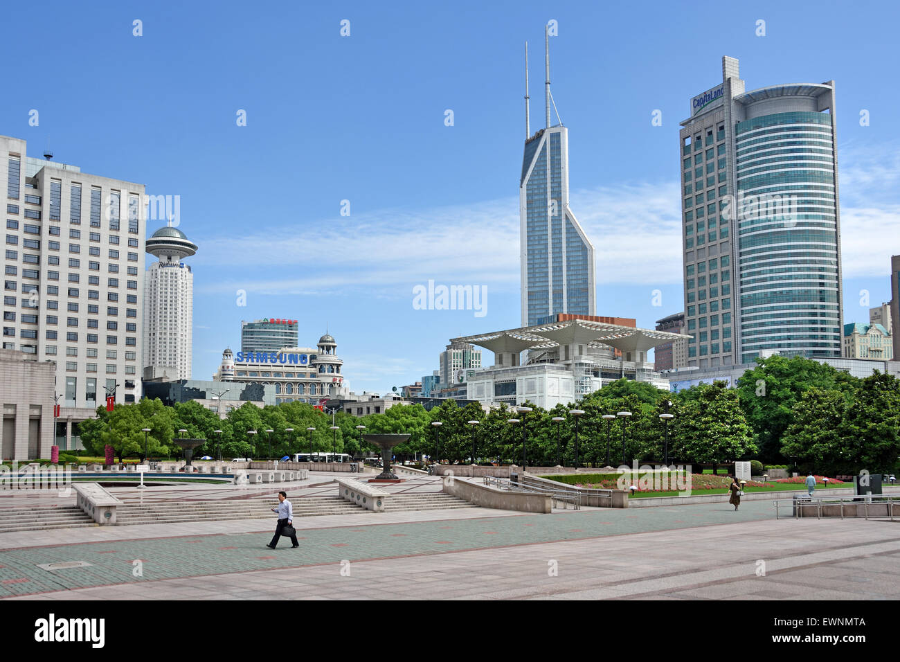 Fountain with people and children, People's Square, Municipal Government Building, Shanghai Municipality ,China skyline city Stock Photo