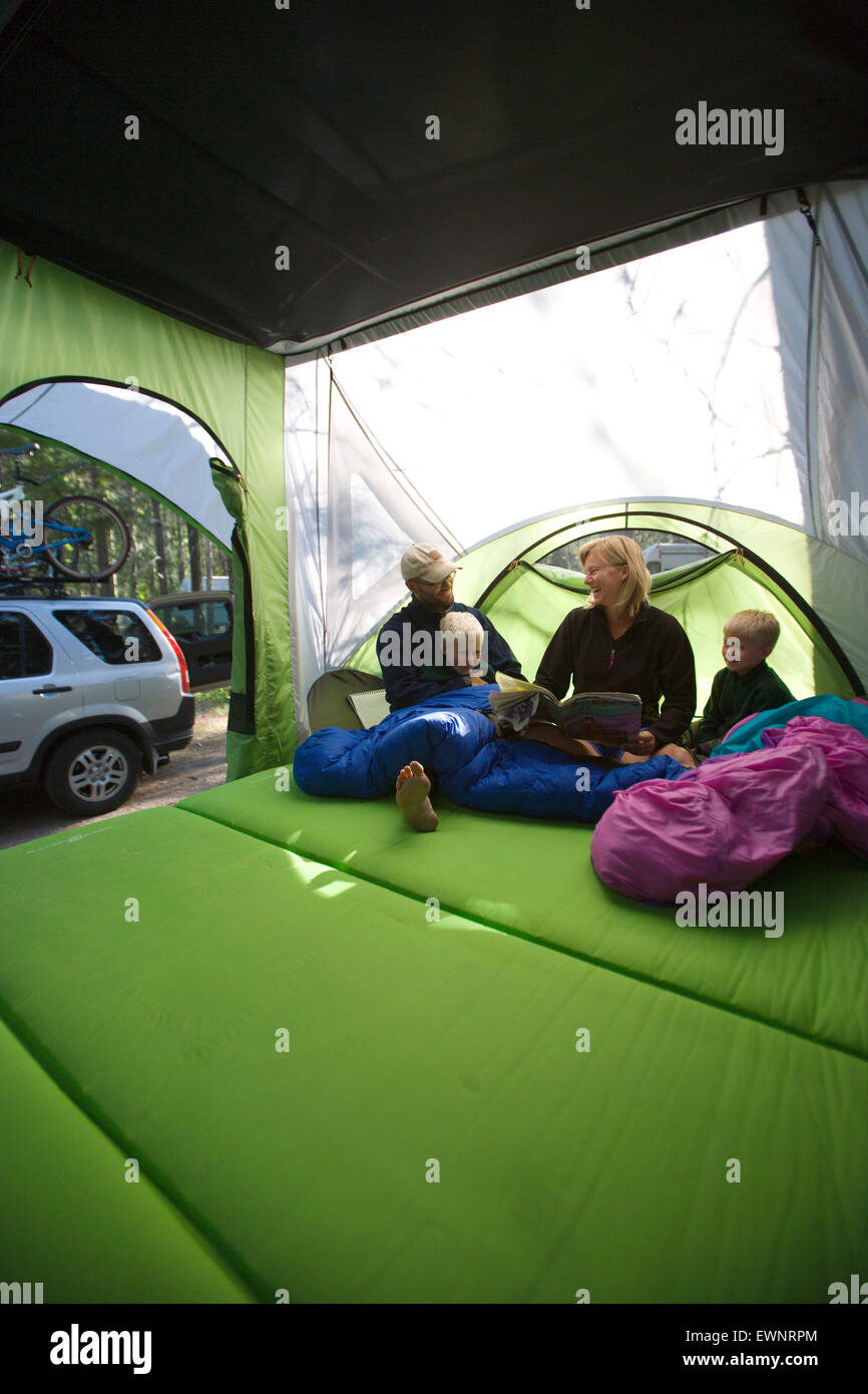 Family camping in new, lightweight travel trailer Stock Photo