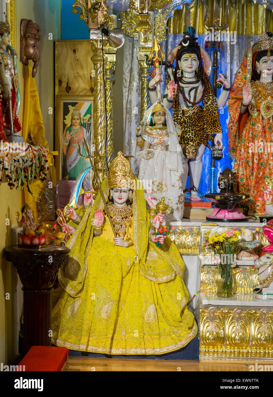 Statuary of Gods on an altar in a temple in Richmond Hill in the New York borough of Queens on Thursday, June 25, 2015. The neighborhood of Richmond Hill is a polyglot of ethnic cultures. It is home to Pakistanis, Indians, Guyanese and has a large Sikh population.  (© Richard B. Levine) Stock Photo