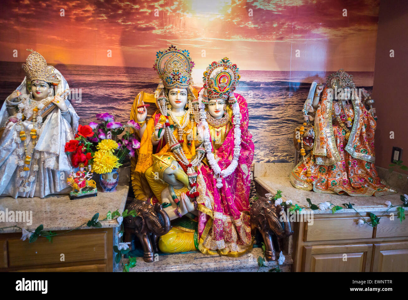 Statuary of Gods on an altar in a temple in Richmond Hill in the New York borough of Queens on Thursday, June 25, 2015. The neighborhood of Richmond Hill is a polyglot of ethnic cultures. It is home to Pakistanis, Indians, Guyanese and has a large Sikh population.  (© Richard B. Levine) Stock Photo