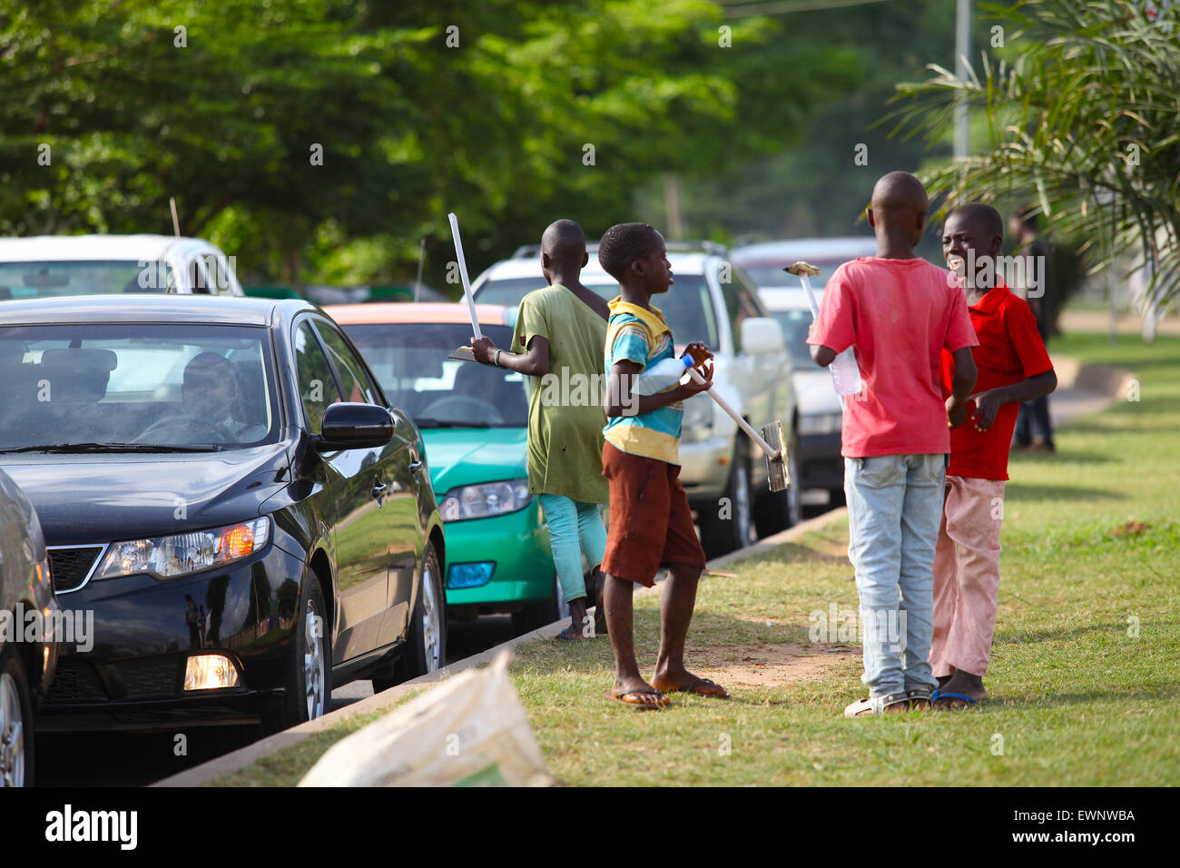 Teenager car wash in Nigeria particularly in Abuja it is phenomenal business in middle of the road. Stock Photo