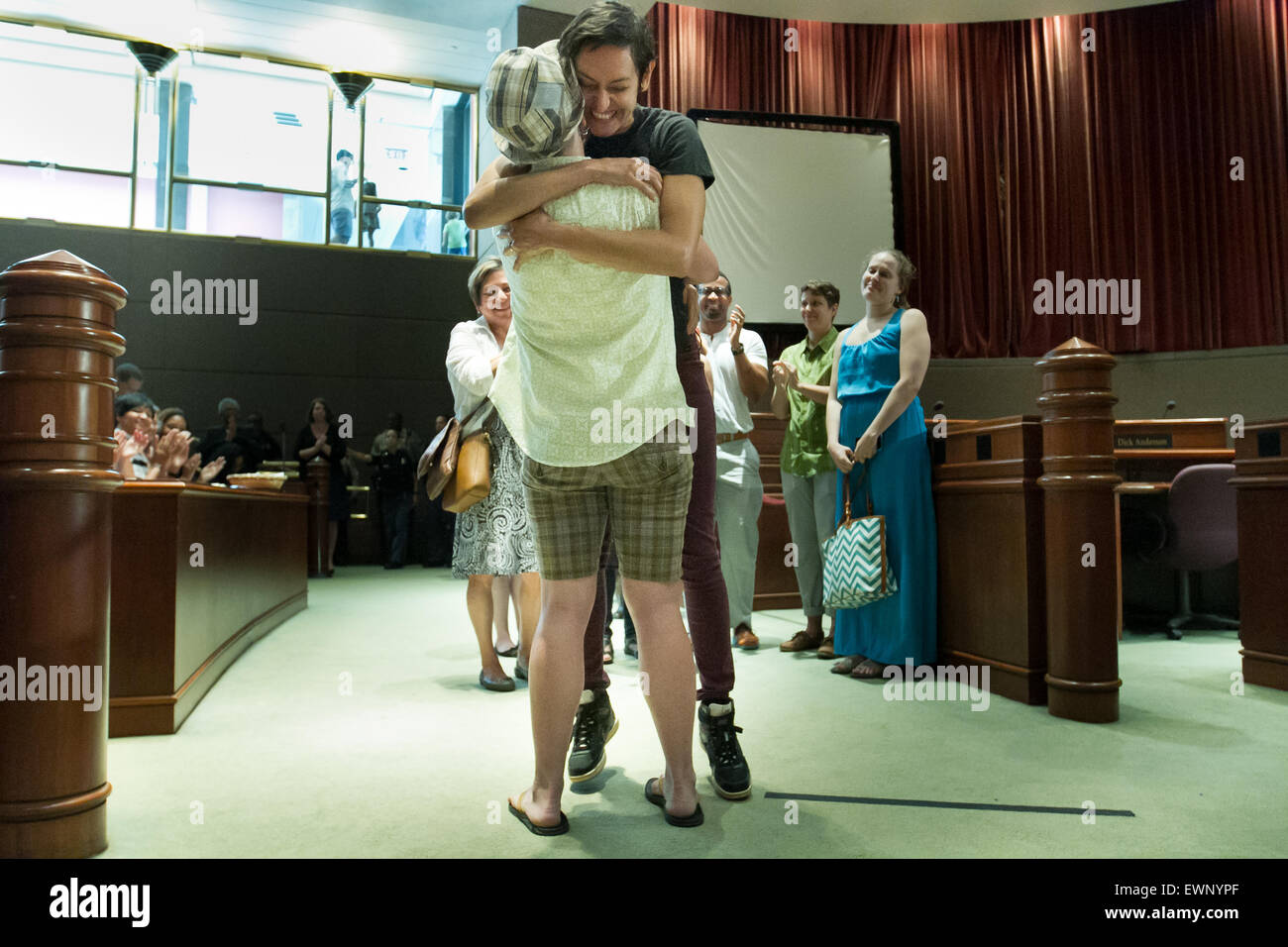 Catherine Simonsen (hat and shorts) and Laura Rivera celebrate together after getting married in Georgia on June 26, 2016. Stock Photo