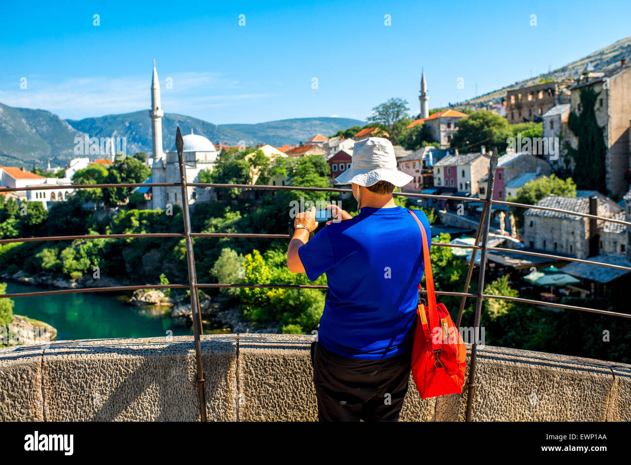 Tourist on the bridge in Mostar city Stock Photo