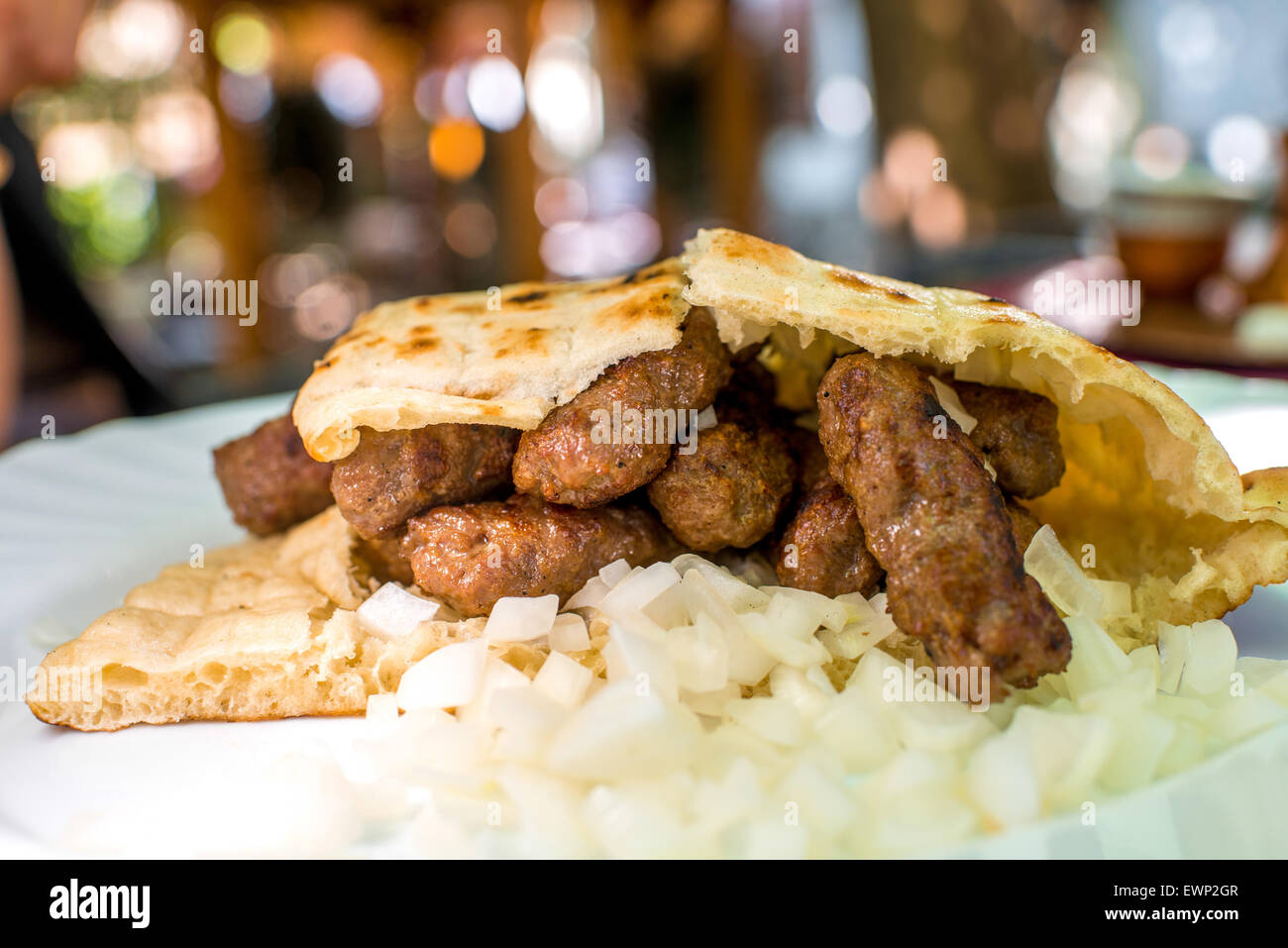 Cevapi with onion and bread Stock Photo