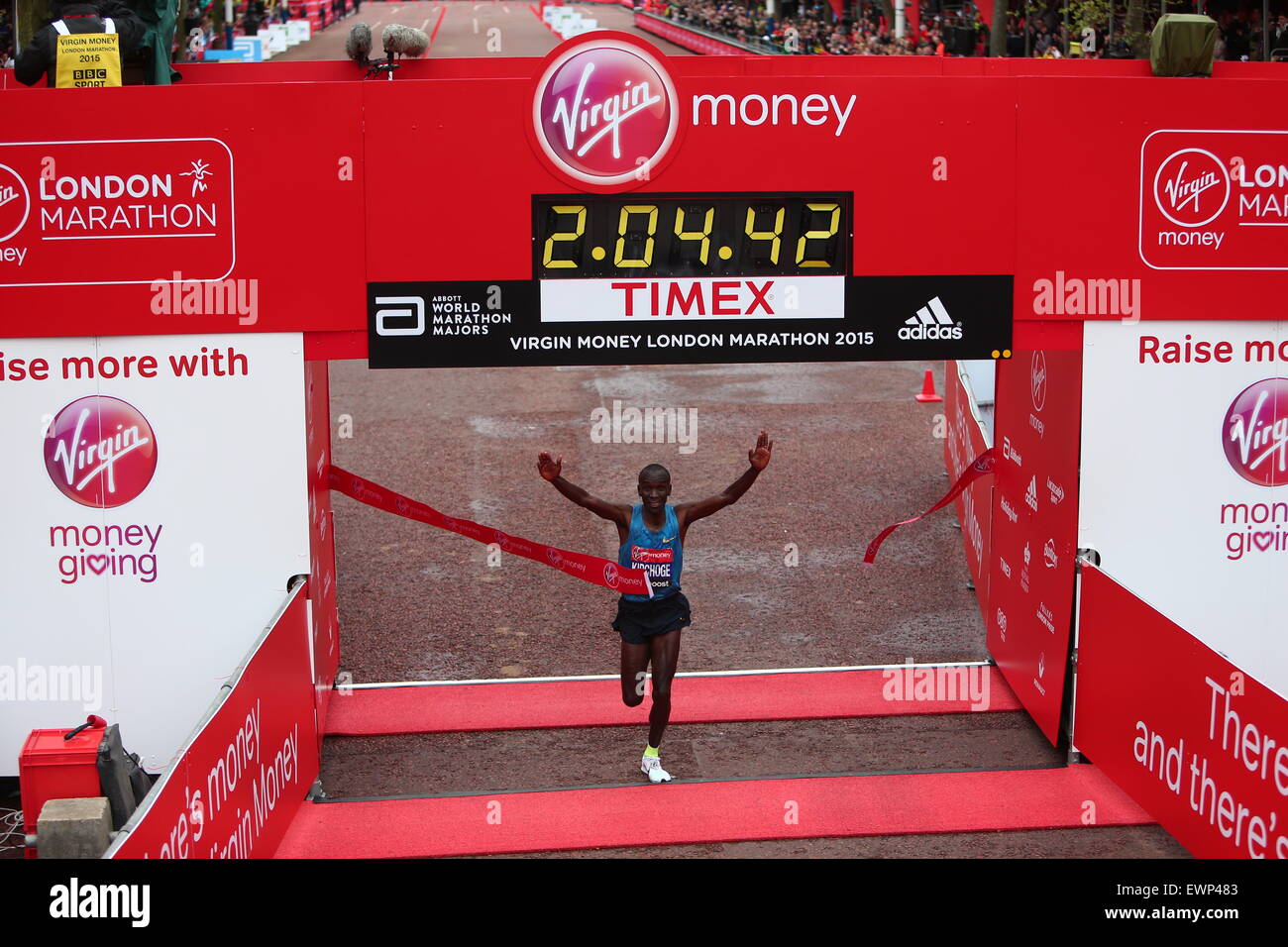 Runners cross the finish line in the Virgin Money London Marathon 2015