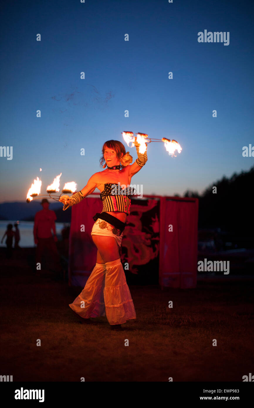 A fire dancer performing outdoors. Stock Photo