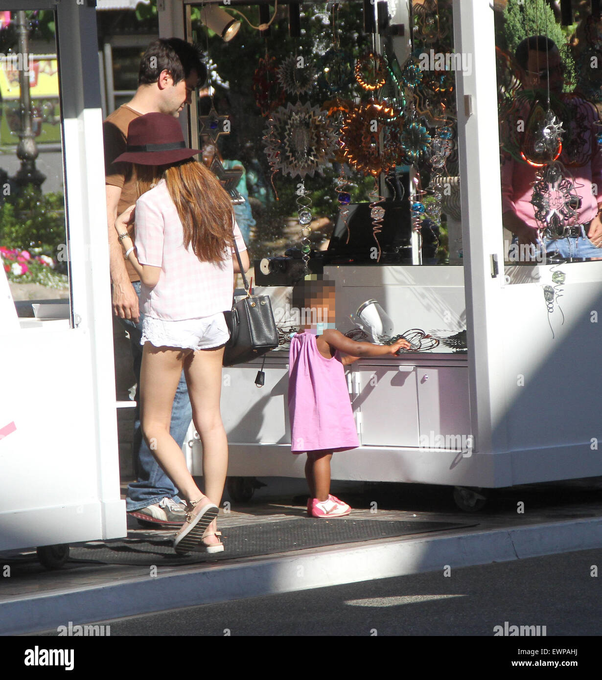 Ron Livingston takes his film actress wife Rosemarie DeWitt and their adopted daughter Gracie James shopping at The Grove in Hollywood  Featuring: Ron Livingston, Gracie James Livingston Where: Los Angeles, California, United States When: 27 Apr 2015 Stock Photo