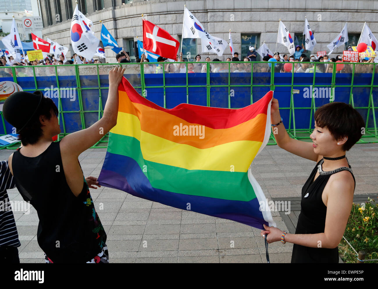 Gay pride parade, Jun 28, 2015 : Participants hold a rainbow flag as ...