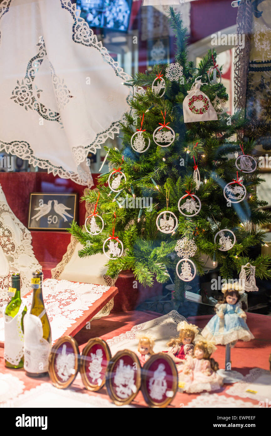 Christmas tree and lace in shop window, Bruges, Belgium Stock Photo