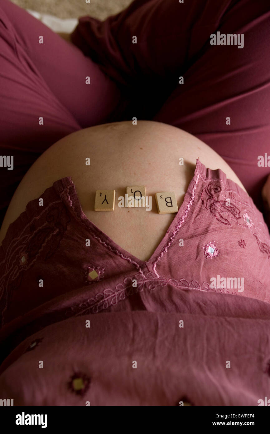Top down view of a pregnant woman's belly with Stock Photo