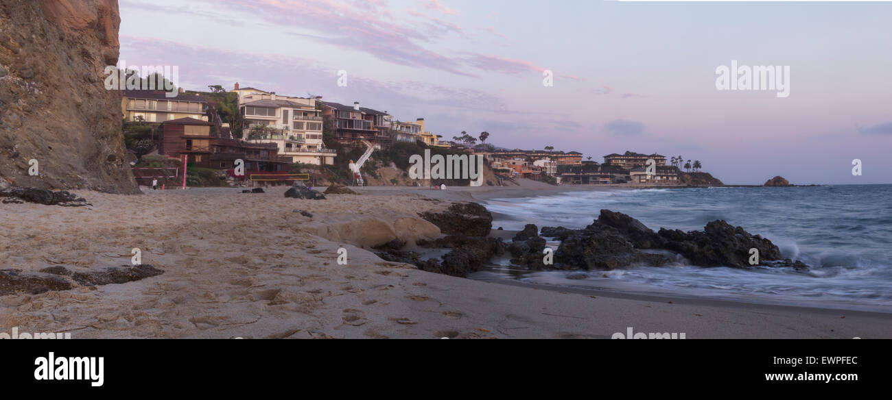 The sunset over beach houses at Victoria Beach in Laguna Beach