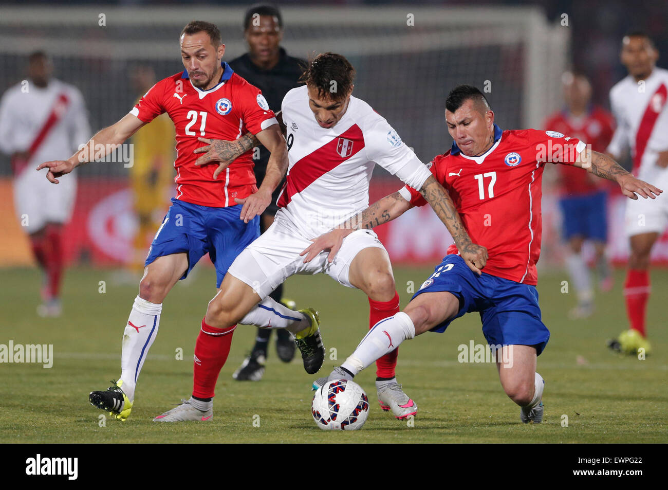 Santiago, Chile. 29th June, 2015. Marcelo Diaz (L) and Gary Medel (R) from Chile vies for the ball with Paolo Guerrero (C) from Peru during the Copa America Chile 2015 semifinal match, held at National Stadium, in Santiago, Chile, on June 29, 2015. Chile won 2-1 Credit:  Guillermo Arias/Xinhua/Alamy Live News Stock Photo