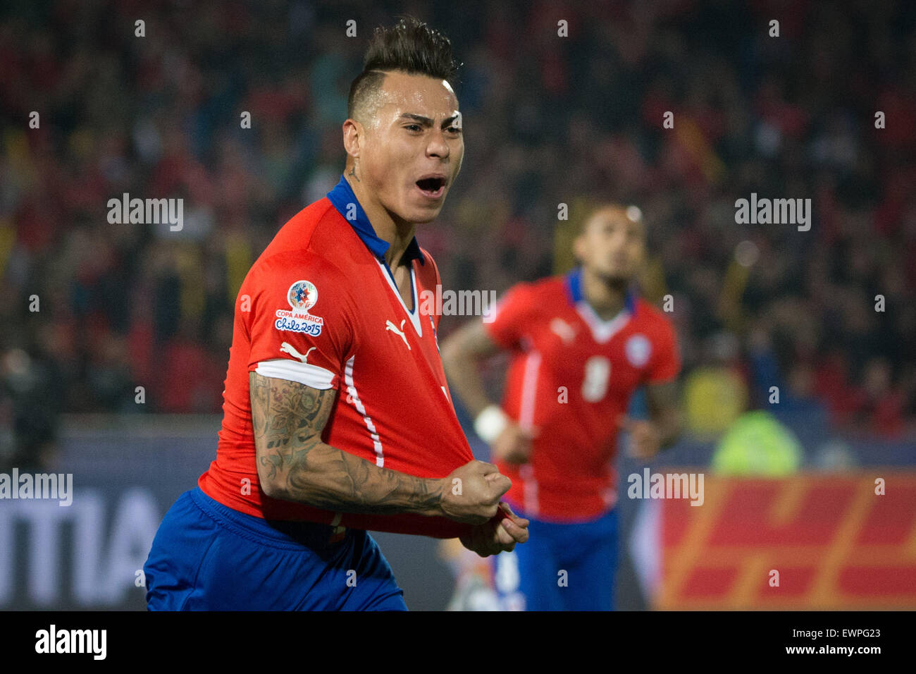 Santiago, Chile. 29th June, 2015. Eduardo Vargas from Chile celebrates scoring against Peru during the Copa America Chile 2015 semifinal match, held at National Stadium, in Santiago, Chile, on June 29, 2015. Chile won 2-1 Credit:  Pedro Mera/Xinhua/Alamy Live News Stock Photo