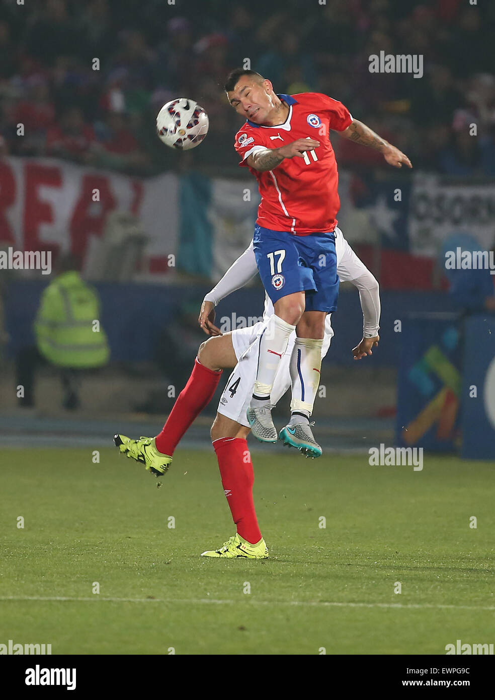 Santiago, Chile. 29th June, 2015. Chile's Gary Medel (top) competes for a header during a semi-final match between Chile and Peru of 2015 American Cup in Santiago, capital of Chile, June 29, 2015. Chile defeated Peru 2-1. Credit:  Xu Zijian/Xinhua/Alamy Live News Stock Photo