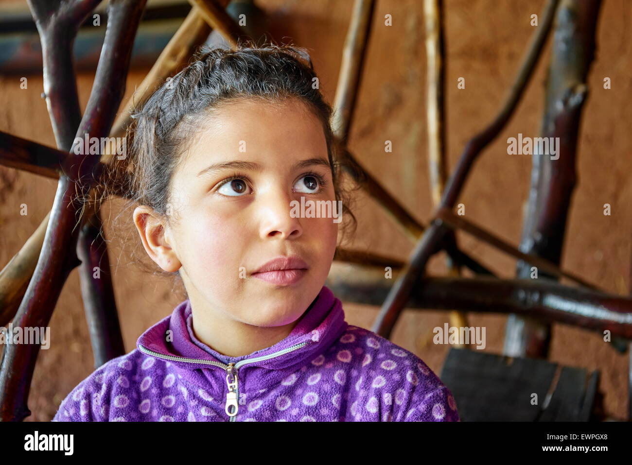 Portrait of a Berber girl inside your traditional home. Ourika Valley, Morocco Stock Photo