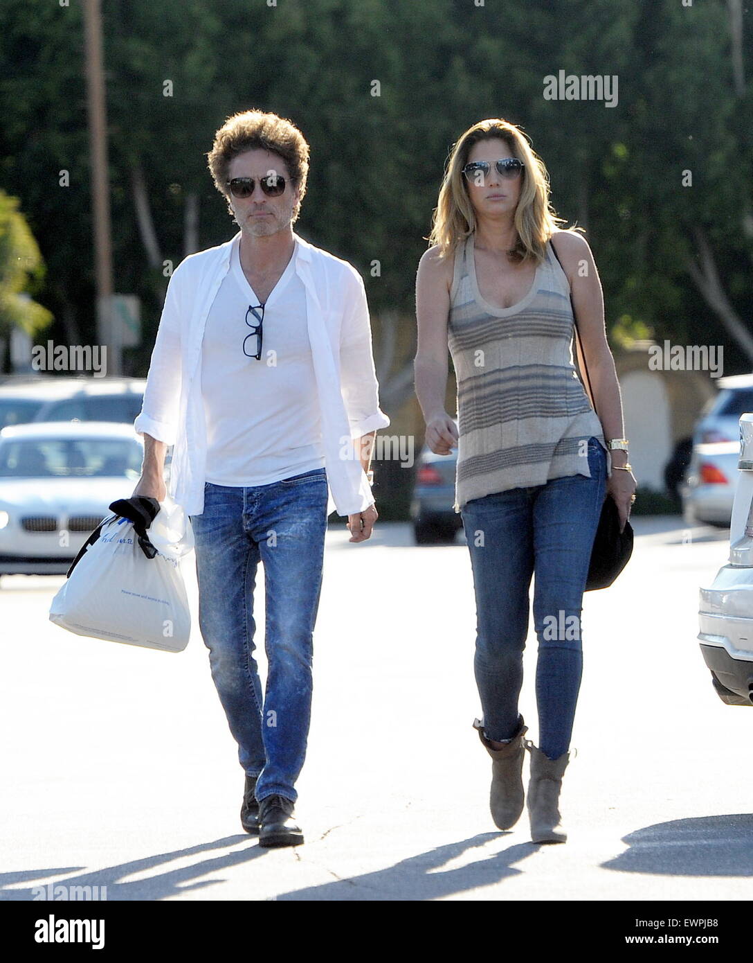 Model Daisy Fuentes flaunts her famous curves at the age of 48 while out shopping with her new boyfriend singer Richard Marx. The new couple were seen holding hands while shopping at Urban Outfitters in Studio City. Daisy also seen checking out her new yellow diamond ring on her wedding ring finger. Richard who recently split from his wife of 25 years last year has been linked to daisy since then.  Featuring: Daisy Fuentes, Richard Marx Where: Studio City, California, United States When: 28 Apr 2015 C Stock Photo